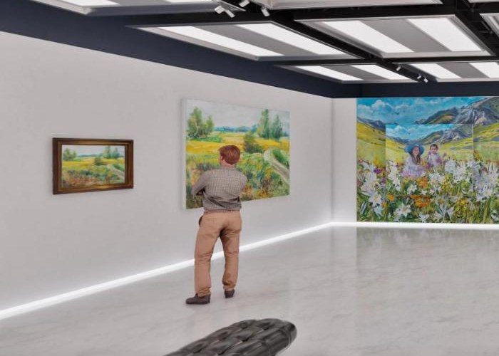Visitor contemplating a painting inside the virtual museum